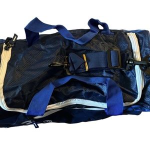 Protege sports carry on nylon bag 18 inches blue with white zipper brand new.